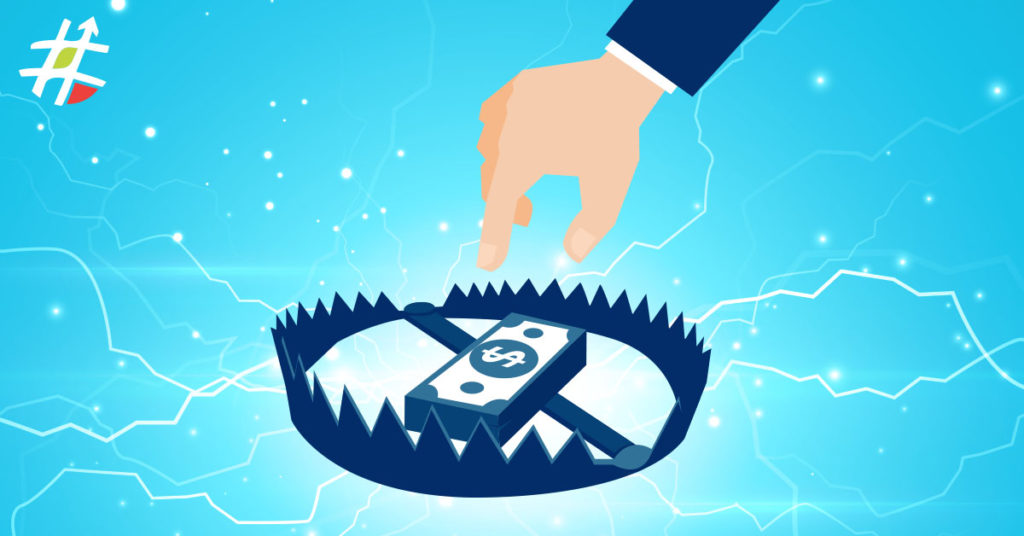 A hand reaching down for money sitting in a bear trap, representing procurement fraud